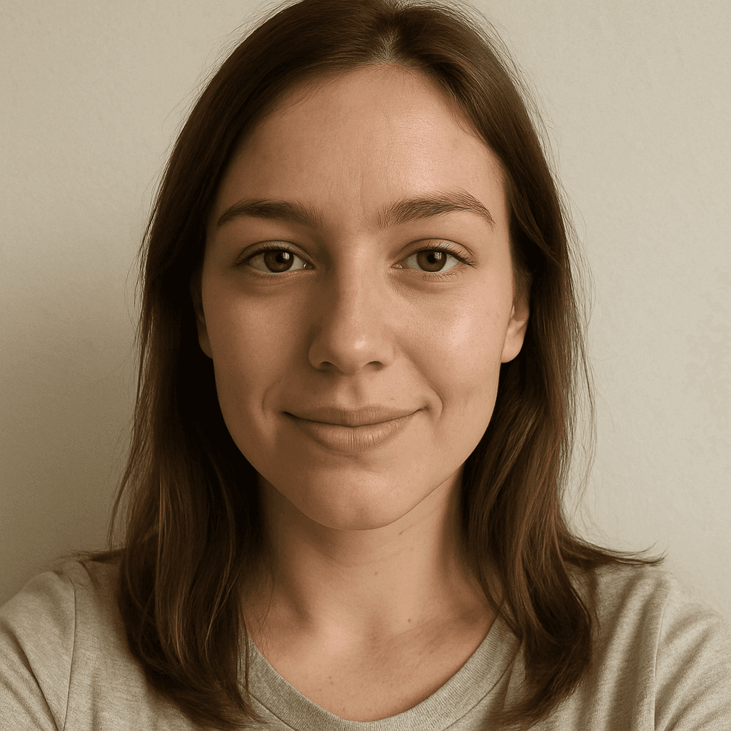 Professional headshot with neutral background and casual tshirt