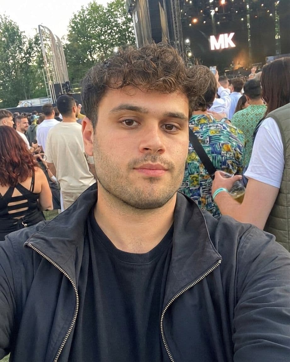After AI jawline editor: man's festival selfie with a sharper, more defined jawline