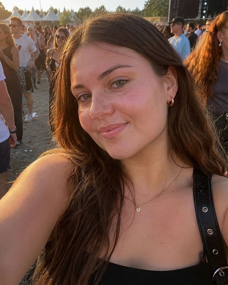 After AI jawline editor: woman's festival selfie with a clear, defined jawline