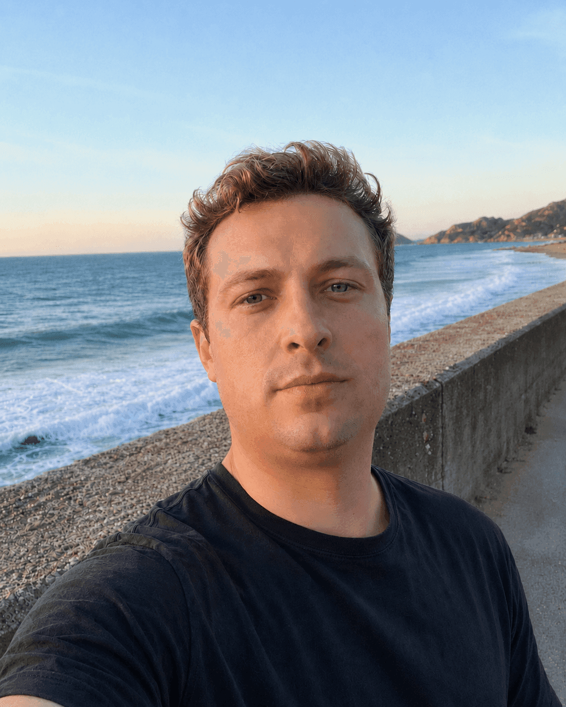 Before define jawline in photos: man's sea-path selfie with a weak, undefined jawline