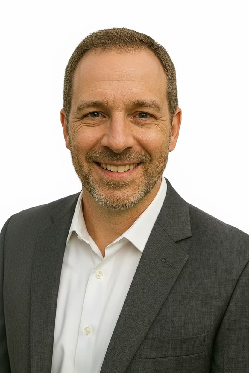 Professional healthcare headshot of a male psychiatrist in business attire charcoal on ffffff background and no accessories